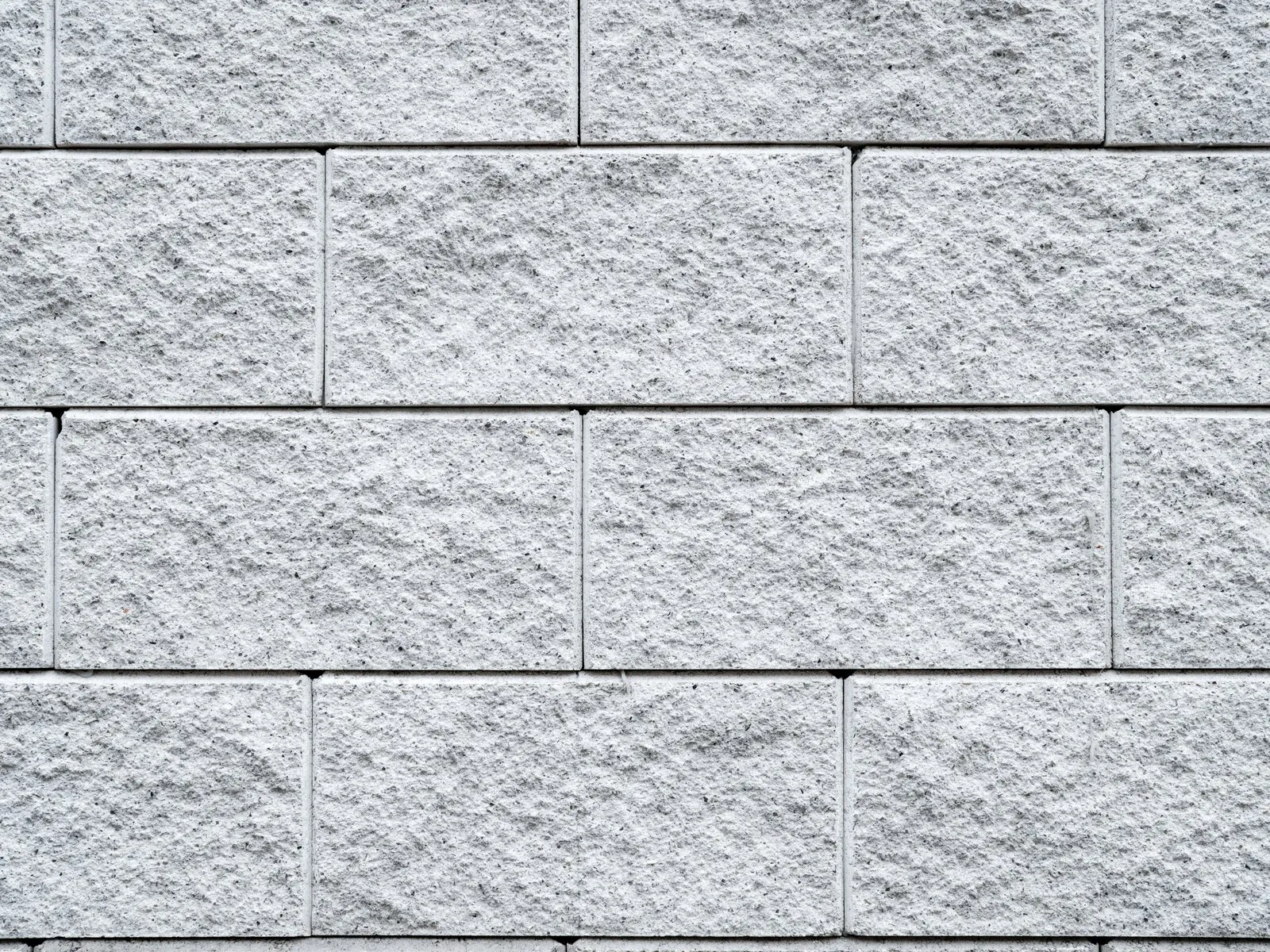 Newly installed CMU block wall perimeter in a residential backyard
